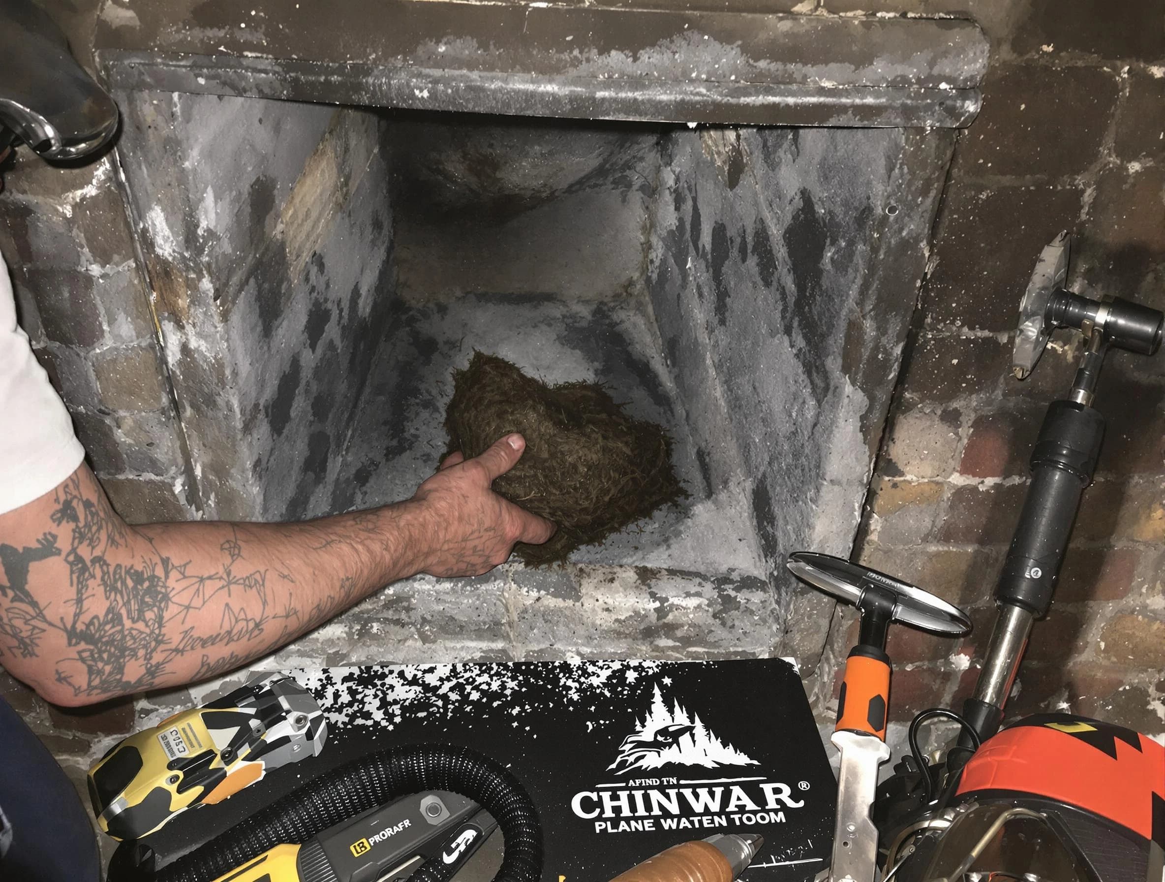 Warrior Chimney Sweep safely removing debris and screening chimney in Warrior, AL